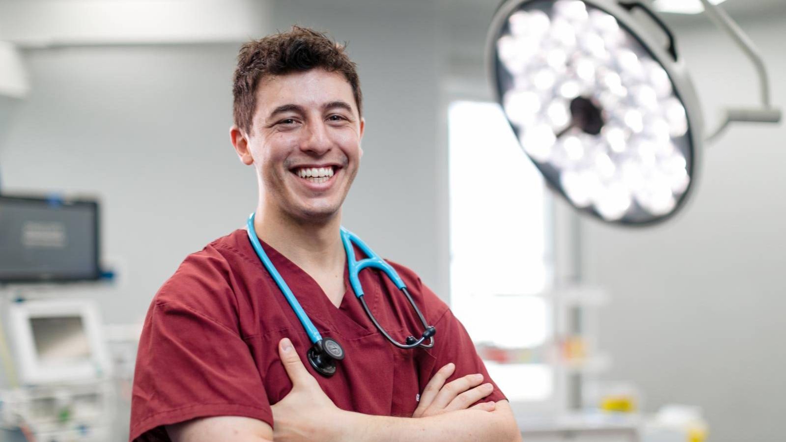 Doctor smiling with crossed arms